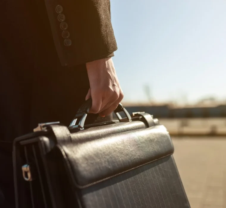 leather-briefcase-his-hand-young-businessman-walking-street